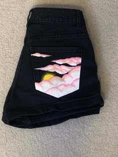 CUSTOM HAND-PAINTED WOMEN'S DENIM SHORTS Sunset clouds painting on back right pocket I WILL PAINT WHATEVER YOU WANT ON ANY DENIM PIECE Pacsun Brand Denim shorts 'Mom Short' Size 23 DM FOR CUSTOM ORDER: This is only one example of a pattern and design that I can paint on any pair of shorts that you want. Dm me for custom orders. You can send me your own denim piece and I can paint it and send it back, or you can tell me the style, size, and what specifically you want painted on them and I'll go buy the shorts and paint them. I use acrylic paint that has been set with heat so that it will not go anywhere.  WASHING INSTRUCTIONS: Wash inside out on delicate cycle and dry as normal. Pink Heat Painted Pants, Sunrise Clouds, Painted Clothes Diy, Doc Martens Outfit, Tokyo Street Fashion, Denim Art, Diy Vetement, Custom Jeans, Thrift Flip