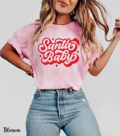 Get festive and flirty with our Santa Baby shirt, featuring "Santa Baby" in a cute retro font topped with an adorable Santa hat. This cozy Comfort Colors shirt is perfect for adding a playful touch to your holiday wardrobe. Whether you're heading to a Christmas party or just embracing the season's spirit, this Christmas Santa Baby tee is a must-have for women who love fun and stylish holiday looks. Perfect as a Christmas party shirt for women or a go-to pink Christmas Santa tee, it's the ultimat Santa Shirt Ideas, Santa Baby Shirt, Pink Christmas Shirt Ideas, Holiday Tshirts Ideas, Baby Christmas Shirt, Santa Tshirt, Santa Tee, Christmas Party Shirts, Cute Santa