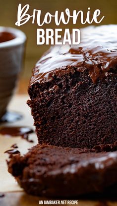 A loaf of brownie bread is on a piece of parchment paper, it has one slice layer in front of it. Next to it is a small bowl of chocolate ganache. Chocolate Brownie Cake Recipe, Brownie Bread, Chocolate Bread Recipe, Dessert Loaf, Brownie Cake Recipe, Chocolate Loaf, Chocolate Brownie Cake, Bread Chocolate, Resep Brownies