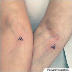 two people with matching tattoos on their legs