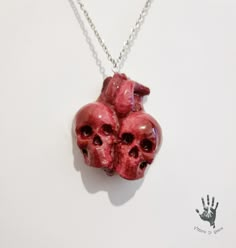 This anatomical heart in the shape of two merging skulls is a perfect gift for lovers of the unusual! Made and painted completely by hand creating a truly realistic blood effect, it is the perfect gift to give to the person of your heart. The size of the whole heart is 1.5748 inches wide x 1,88976 inches high. The chain is 20,4724 inches long. The chain is made of stainless steel. but if you have special needs do not hesitate to contact me! Blood Effect, Heart Clay, Heart Clutch, Spike Bracelet, Heart Decor, Anatomical Heart, Whole Heart, Jewelry Lookbook, Pretty Bracelets