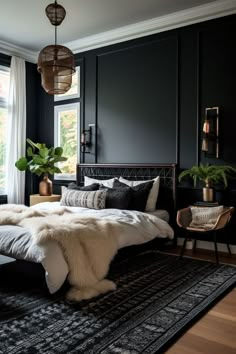 a bedroom with black walls, white bedding and fur rugs on the floor