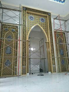 scaffolding around an ornate doorway in a building