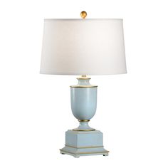 a blue lamp with a white shade on it