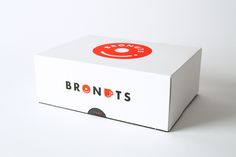 a white box with a red donut on the front and bottom that says brontots