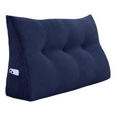 a blue pillow with a small white button on the side and a black corded cover