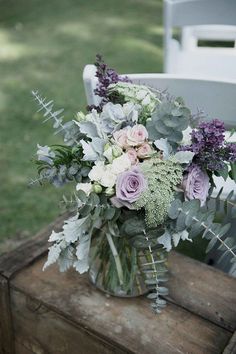 three different pictures of flowers and greenery in vases on a wooden table outside