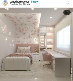 a bedroom decorated in pink and white with flowers on the wall, bed, desk and chair