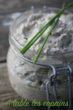 a close up of a jar of food on a table