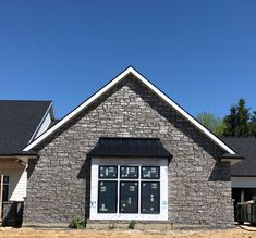 the front of a brick house with windows