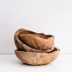 three wooden bowls stacked on top of each other