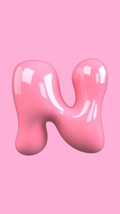 a pink object is floating in the air on a pink background with no one around it