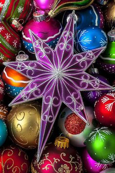 an image of christmas ornaments on a colorful background