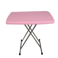 a pink table with metal legs on a white background