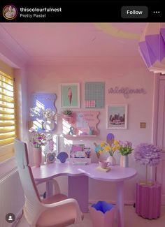 a pink desk and chair in a room with pictures on the wall above it, along with other decorations