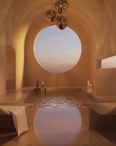 a large round window in the middle of a room with white walls and flooring