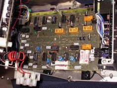 an electronic board with many wires attached to it