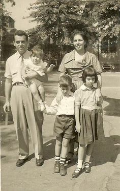 an old black and white photo of a family