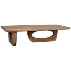 a wooden table sitting on top of a white wall