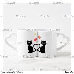 two cats in love mugs with hearts on the side and one cat holding a heart