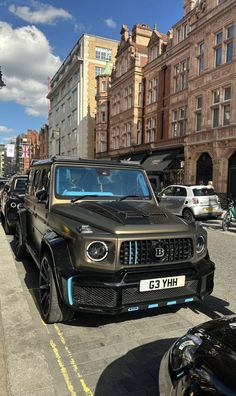 a line of cars parked on the side of a street