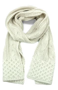 Adorned with a plush cable knit pattern, this supersoft knit scarf is essential to enduring cold weather with grace and style. 60% lambs wool, 20% nylon, 20% angora Dry clean Imported Casual Cream Scarves For Winter, Casual Cream Scarf For Winter, Elegant Knitted Scarves For Winter, Casual Cable Knit Scarf For Fall, Casual Alpaca Scarf For Winter, Casual Cable Knit Scarves For Winter, Casual Alpaca Scarves For Winter, Winter Cable Knit Scarves For Cold Weather, Cozy Cable Knit Scarf For Cold Weather