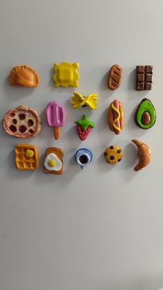 there are many different food items on the refrigerator magnets that look like they were made out of plastic