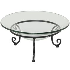 an oval glass table with metal legs