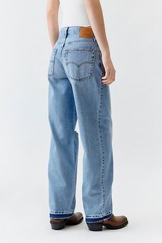 Vintage-inspired Dad jeans from Levi’s® with a perfectly broken-in feel. Cut in a mid-rise silhouette with a slouchy straight leg that falls just below the ankle. Features Levi’s® dad jeans a mid-rise and a loose and relaxed straight leg Crafted from rigid denim that will soften over time or denim with a hint of stretch for comfort & fit Logo patch at the back Zip fly; 5-pocket styling Content + Care 100% Cotton Tinted denim, Vintage denim medium: 79% Cotton, 21% lyocell Black: 95% Cotton, 5% recycled cotton Machine wash Imported Size + Fit Mid rise Straight leg Full length Model in Black is 5’10" and wearing size 27 Measurements taken from size 28 Waist: 31.5" Rise: 10.75" Inseam: 32" | Levi's Baggy Dad Jean in Light Blue, Women's at Urban Outfitters Fit Logo, Classic American Style, Light Flare, Dad Jeans, Loose Fit Jeans, Blue Fits, Mid Rise Jeans, Comfy Casual, Slim Fit Jeans