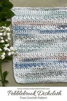 a crocheted dishcloth with flowers on the side and text overlay that reads pebble hook dishcloth free crochet pattern