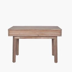 a small wooden table sitting on top of a white wall