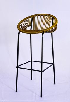 a stool made out of wicker and black metal legs on a white background with the seat up