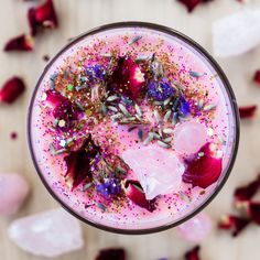 a drink with sprinkles and flowers in it