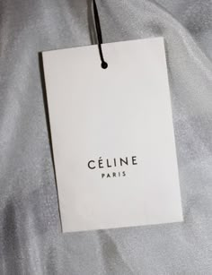 an image of a cell phone with the name geline paris hanging from it's screen