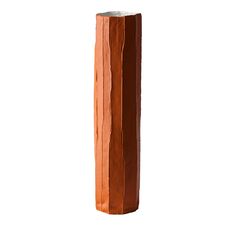 a tall piece of wood that has been cut in half and is standing upright on a white background