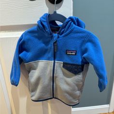 Blue And Gray Fleece Patagonia Zip Up Fleece Jacket For Baby. Brand New With Tags. Size 3-6 Months. Stock Photo From Patagonia Website Included For Reference Only! Patagonia Zip Up Fleece Jackets, Patagonia Zip Up, Fleece Patagonia, Patagonia Baby, Baby Patagonia, Patagonia Kids, Month Colors, Patagonia Jacket, Kids Jacket