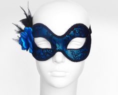 Metallic Blue And Black Lace Masquerade Mask by SOFFITTA Blue Masquerade Mask For Halloween Party, Blue Masquerade Mask For Halloween Costume Party, Blue Party Eye Mask, Blue Masquerade Mask For Halloween, Blue Venetian Masquerade Mask For Party, Blue Halloween Masquerade Mask, Blue Masks And Prosthetics For Carnival Party, Blue Eye Mask For Party, Blue Venetian Masks For Masquerade