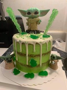 a cake decorated with green icing and decorations