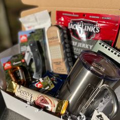 an open box containing coffee, tea and snacks