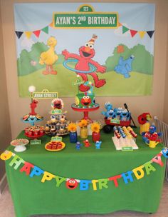 a sesame street birthday party with cake and decorations