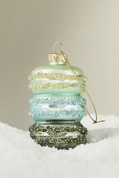 a stack of bracelets sitting on top of a pile of white snow covered ground