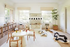 a living room filled with furniture and lots of windows