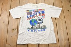 a t - shirt that says world cup soccer in chicago on the front and back