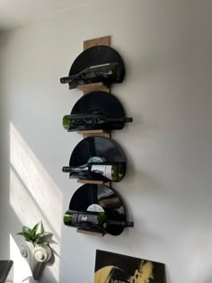 Vinyl record bottle holder, vinyl record wine rack, upcycled vinyl records, handmade Vinyl Holder Ideas Diy, Vinyl Apartment Decor, Vinyl Record Display Wall Art, Vinyl Decor Ideas Wall, Record Holder Ideas, Black Aesthetic Room Decor, Record Collection Display, Records On Wall Aesthetic, Vinyl Record Room Decor