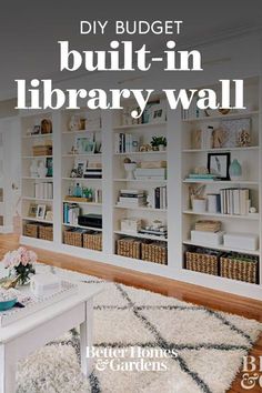 a living room filled with lots of white furniture and bookshelves on the wall