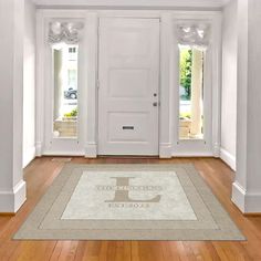 an empty room with white walls and wooden floors is shown in front of the door