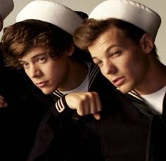 three young men in sailor's hats are posing for a photo with one pointing at the camera