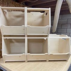 the shelves are made from plywood and have been painted white with some paint on them