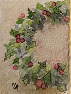 a watercolor painting of holly wreath with red berries and green leaves on white paper