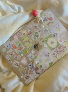 an assortment of stickers on top of a laptop